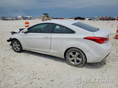 Czwarte zdjęcie samochodu z boku: 2013 HYUNDAI ELANTRA COUPE GS VIN:KMHDH6AE7DU013734 - miniatura