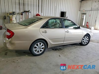Trzecie zdjęcie samochodu z tyłu: 2003 TOYOTA CAMRY XLE V6 VIN:JTDBF30K730151318 - miniatura