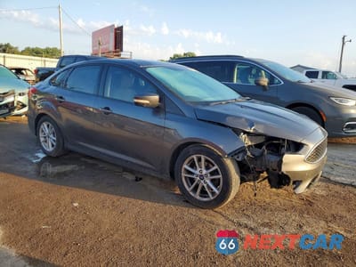 Czwarte zdjęcie samochodu z boku: 2015 FORD FOCUS SE VIN:1FADP3F20FL240895 - miniatura