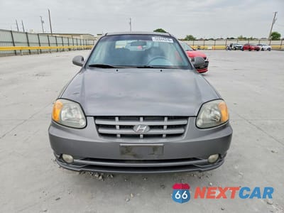 Piąte zdjęcie samochodu w środku: 2005 HYUNDAI ACCENT GS VIN:KMHCG35C75U322188 - miniatura