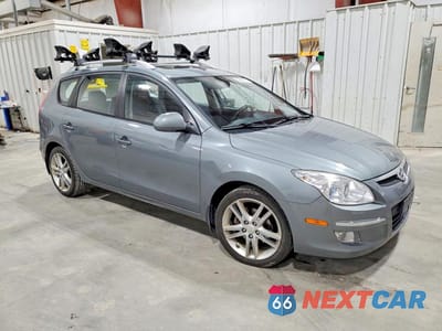 Czwarte zdjęcie samochodu z boku: 2011 HYUNDAI ELANTRA TOURING SE VIN:KMHDC8AE3BU089698 - miniatura