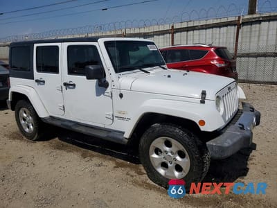 Czwarte zdjęcie samochodu z boku: 2014 JEEP WRANGLER UNLIMITED SAHARA VIN:1C4BJWEG0EL212501 - miniatura