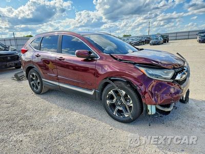 Czwarte zdjęcie samochodu z boku: 2017 HONDA CR-V TOURING VIN:2HKRW1H90HH506764 - miniatura