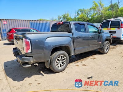 Trzecie zdjęcie samochodu z tyłu: 2016 GMC CANYON SLE VIN:1GTG6CE34G1106215 - miniatura
