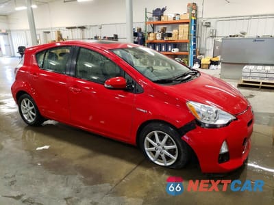 Czwarte zdjęcie samochodu z boku: 2012 TOYOTA PRIUS C FOUR VIN:JTDKDTB31C1023632 - miniatura