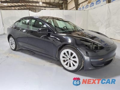 Czwarte zdjęcie samochodu z boku: 2023 TESLA MODEL 3 VIN:5YJ3E1EA6PF434196 - miniatura