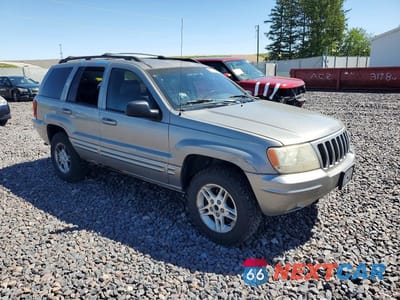 Czwarte zdjęcie samochodu z boku: 1999 JEEP GRAND CHEROKEE LIMITED VIN:1J4GW68N5XC638750 - miniatura