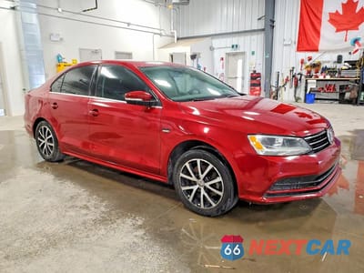 Czwarte zdjęcie samochodu z boku: 2016 VOLKSWAGEN JETTA SE VIN:3VWD67AJ1GM401173 - miniatura