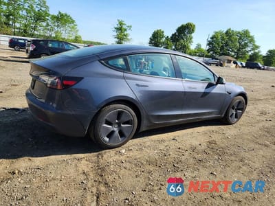 Trzecie zdjęcie samochodu z tyłu: 2022 TESLA MODEL 3 VIN:5YJ3E1EB4NF203190 - miniatura