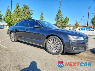 Czwarte zdjęcie samochodu z boku: 2015 AUDI A8 L QUATTRO VIN:WAU3GAFD6FN010582 - miniatura