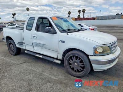 Czwarte zdjęcie samochodu z boku: 2000 FORD F150 VIN:1FTRX07W3YKB00221 - miniatura