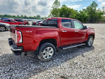 Trzecie zdjęcie samochodu z tyłu: 2016 GMC CANYON SLT VIN:1GTG6DE3XG1218152 - miniatura