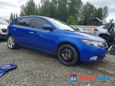 Czwarte zdjęcie samochodu z boku: 2011 KIA FORTE SX VIN:KNAFW5A32B5358413 - miniatura