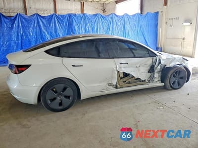Trzecie zdjęcie samochodu z tyłu: 2023 TESLA MODEL 3 VIN:5YJ3E1EA7PF494357 - miniatura