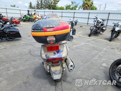 Czwarte zdjęcie samochodu z boku: 2006 HONDA FSC600 A VIN:JH2PF014X6K300213 - miniatura