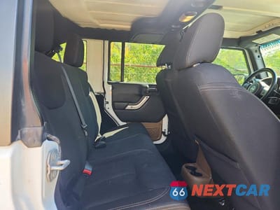 Zdjęcie 11 z 13 samochodu: 2015 JEEP WRANGLER UNLIMITED SAHARA VIN:1C4BJWEG0FL516400 - miniatura