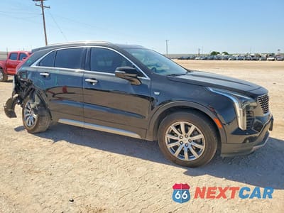 Czwarte zdjęcie samochodu z boku: 2022 CADILLAC XT4 PREMIUM LUXURY VIN:1GYFZDR44NF100095 - miniatura