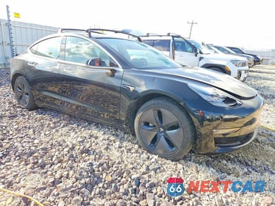 Czwarte zdjęcie samochodu z boku: 2018 TESLA MODEL 3 VIN:5YJ3E1EBXJF182209 - miniatura