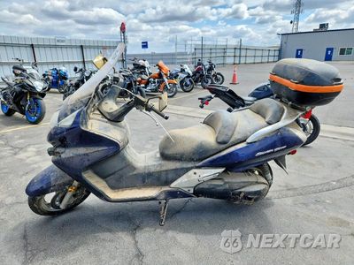 Trzecie zdjęcie samochodu z tyłu: 2006 HONDA FSC600 A VIN:JH2PF014X6K300213 - miniatura