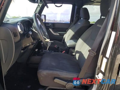 Zdjęcie 7 z 14 samochodu: 2016 JEEP WRANGLER UNLIMITED SAHARA VIN:1C4BJWEG1GL283693 - miniatura