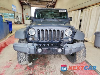 Piąte zdjęcie samochodu w środku: 2017 JEEP WRANGLER SPORT VIN:1C4AJWAGXHL577113 - miniatura