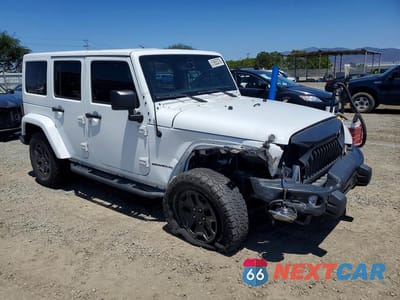Czwarte zdjęcie samochodu z boku: 2016 JEEP WRANGLER UNLIMITED SAHARA VIN:1C4BJWEGXGL173130 - miniatura