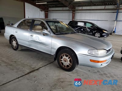 Czwarte zdjęcie samochodu z boku: 1994 TOYOTA CAMRY XLE VIN:JT2GK13E0R0020339 - miniatura