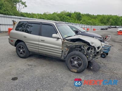 Czwarte zdjęcie samochodu z boku: 1999 TOYOTA RAV4 BASE VIN:JT3HP10V2X7141013 - miniatura