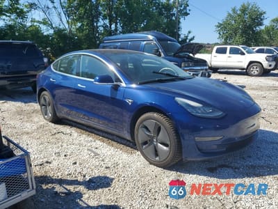 Czwarte zdjęcie samochodu z boku: 2018 TESLA MODEL 3 VIN:5YJ3E1EA6JF017006 - miniatura