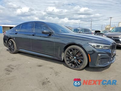 Czwarte zdjęcie samochodu z boku: 2022 BMW 740 I VIN:WBA7T2C07NCJ53362 - miniatura