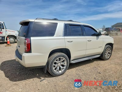 Trzecie zdjęcie samochodu z tyłu: 2015 GMC YUKON SLT VIN:1GKS2BKC1FR110697 - miniatura
