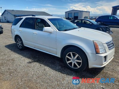 Czwarte zdjęcie samochodu z boku: 2004 CADILLAC SRX VIN:1GYDE63A940126786 - miniatura
