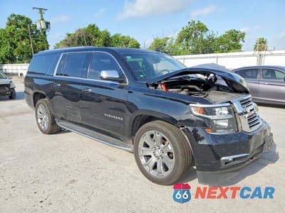 Czwarte zdjęcie samochodu z boku: 2016 CHEVROLET SUBURBAN C1500 LTZ VIN:1GNSCJKC8GR470688 - miniatura
