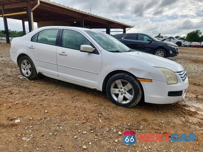 Czwarte zdjęcie samochodu z boku: 2006 FORD FUSION SE VIN:3FAFP07196R188875 - miniatura