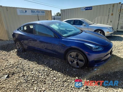 Czwarte zdjęcie samochodu z boku: 2023 TESLA MODEL 3 VIN:5YJ3E1EA4PF451515 - miniatura
