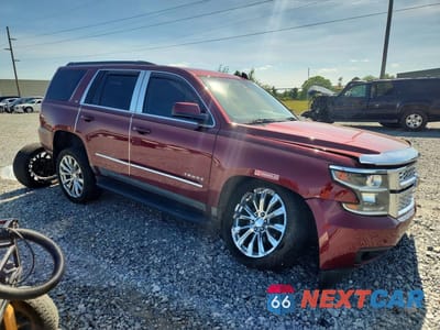 Czwarte zdjęcie samochodu z boku: 2018 CHEVROLET TAHOE C1500 LT VIN:1GNSCBKCXJR247260 - miniatura