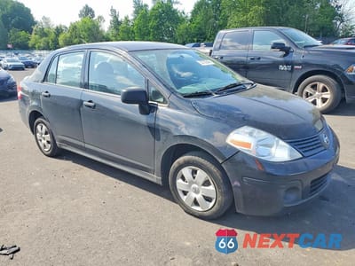 Czwarte zdjęcie samochodu z boku: 2011 NISSAN VERSA 1.6 BASE VIN:3N1CC1AP6BL409277 - miniatura