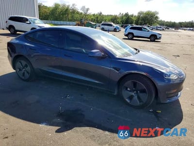 Czwarte zdjęcie samochodu z boku: 2021 TESLA MODEL 3 VIN:5YJ3E1EA4MF085129 - miniatura