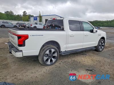 Trzecie zdjęcie samochodu z tyłu: 2023 FORD F150 LIGHTNING PRO VIN:1FT6W1EV2PWG01047 - miniatura