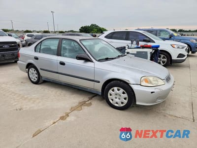 Czwarte zdjęcie samochodu z boku: 1999 HONDA CIVIC LX VIN:1HGEJ6672XL043291 - miniatura