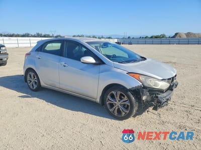 Czwarte zdjęcie samochodu z boku: 2013 HYUNDAI ELANTRA GT BASE VIN:KMHD35LE1DU082540 - miniatura
