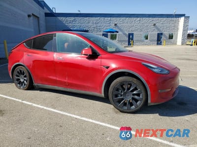 Czwarte zdjęcie samochodu z boku: 2021 TESLA MODEL Y VIN:5YJYGDEE2MF285494 - miniatura