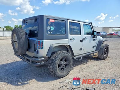 Trzecie zdjęcie samochodu z tyłu: 2011 JEEP WRANGLER UNLIMITED SPORT VIN:1J4BA3H17BL582713 - miniatura