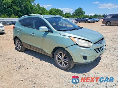 Czwarte zdjęcie samochodu z boku: 2011 HYUNDAI TUCSON GLS VIN:KM8JUCAC7BU264472 - miniatura