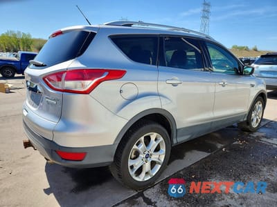 Trzecie zdjęcie samochodu z tyłu: 2016 FORD ESCAPE TITANIUM VIN:1FMCU0J97GUC11838 - miniatura