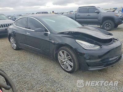 Czwarte zdjęcie samochodu z boku: 2018 TESLA MODEL 3 VIN:5YJ3E1EBXJF187670 - miniatura