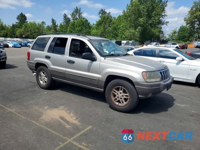 Czwarte zdjęcie samochodu z boku: 2003 JEEP GRAND CHEROKEE LAREDO VIN:1J4GW48N53C554507 - miniatura