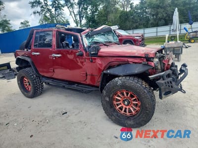 Czwarte zdjęcie samochodu z boku: 2011 JEEP WRANGLER UNLIMITED SPORT VIN:1J4BA3H1XBL586545 - miniatura