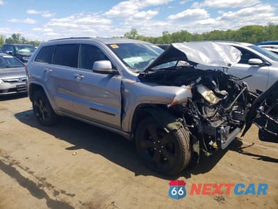 Czwarte zdjęcie samochodu z boku: 2015 JEEP GRAND CHEROKEE LAREDO VIN:1C4RJFAG5FC924136 - miniatura