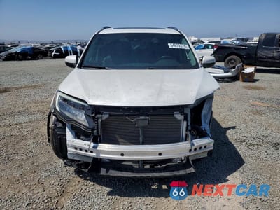 Piąte zdjęcie samochodu w środku: 2022 HONDA PILOT TOURING VIN:5FNYF5H63NB023983 - miniatura